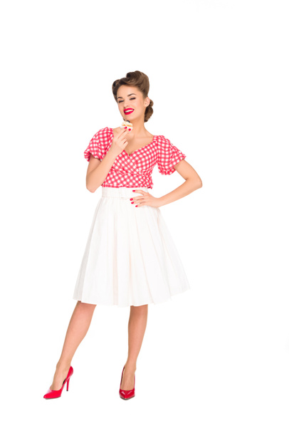 beautiful smiling woman in pin up clothing with cupcake isolated on white - Fotoğraf, Görsel