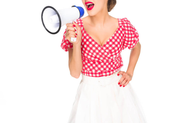 cropped shot of fashionable woman in pin up style clothing with loudspeaker isolated on white - Foto, Bild