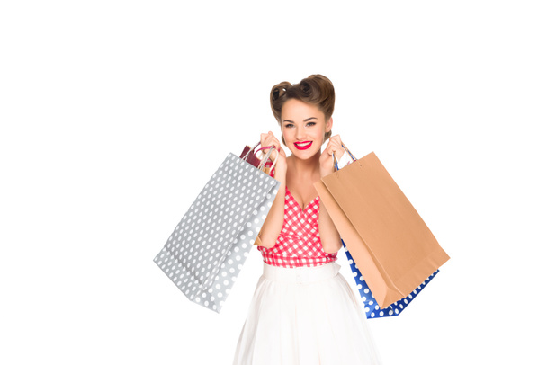 smiling woman in retro style clothing with shopping bags isolated on white - Φωτογραφία, εικόνα