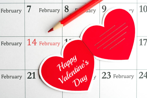 14. Februar Valentinstag. Grußkarte und Bleistift auf dem Kalender - Foto, Bild