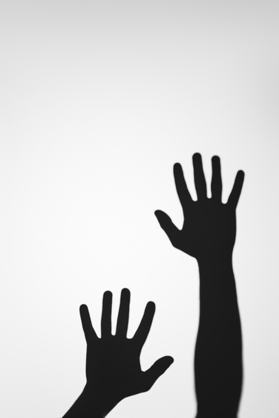 ijesztő, titokzatos árnyékában emberi kéz a szürke - Fotó, kép
