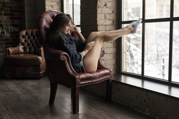 Slender brunette posing in studio - Photo, Image