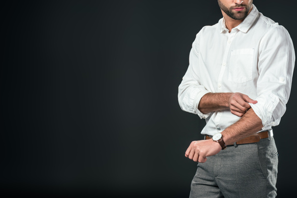 cropped view of handsome businessman in white shirt, isolated on black - Foto, afbeelding