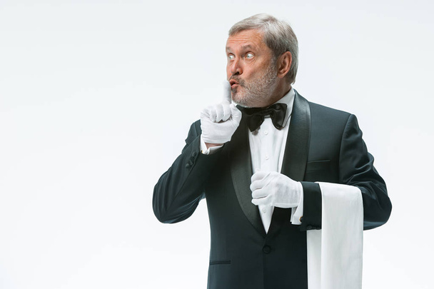 Senior waiter holding white towel - Zdjęcie, obraz