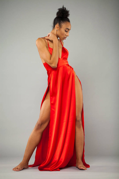 Young african woman in long red dress - Photo, Image