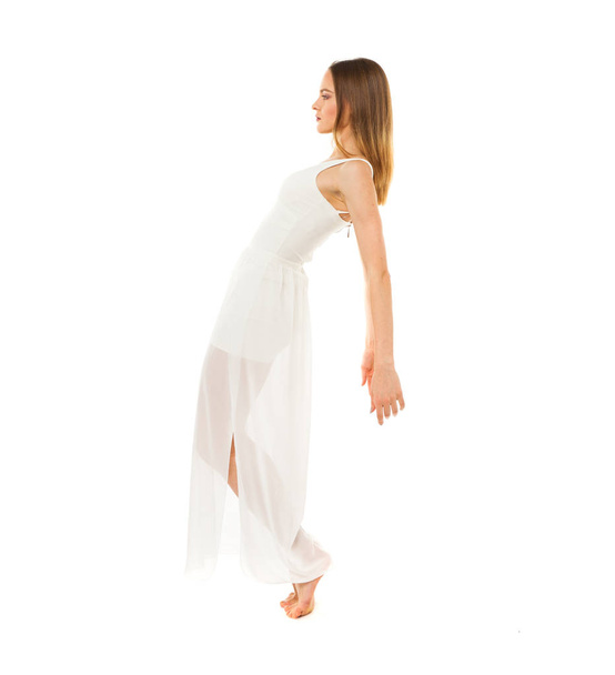 Portrait in full length, young slender woman in white dress - 写真・画像
