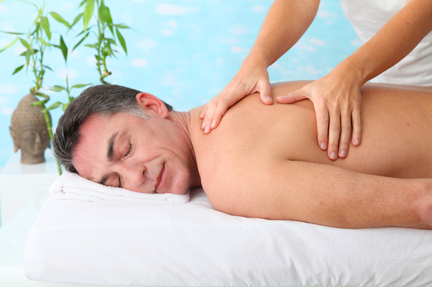 Man having a massage in a spa center - Photo, Image