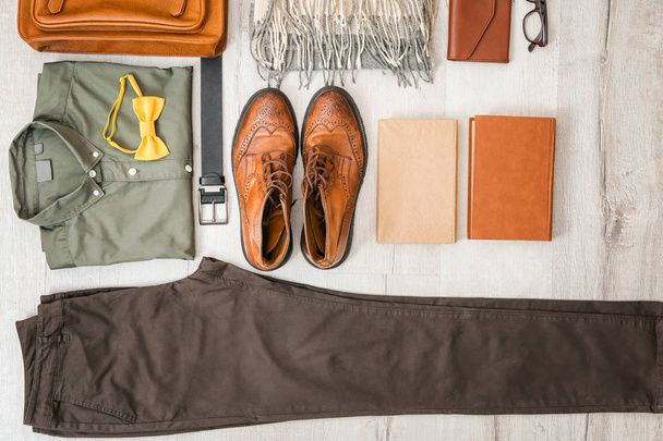 Set of stylish male hipster clothes on wooden background - 写真・画像