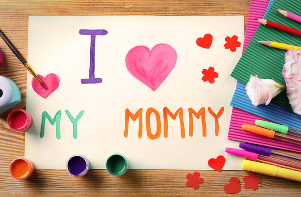 Cute handmade card with text I LOVE MY MOMMY on wooden table. Mother's day celebration - Fotografie, Obrázek