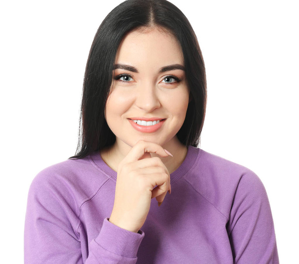Portrait of young smiling woman on white background - Foto, Imagen
