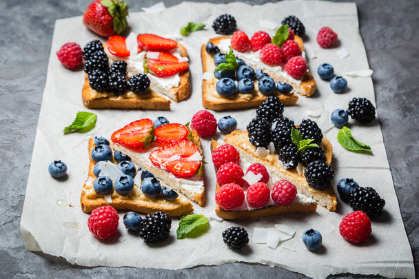 Selection of toasts with cheese peanut butter and berries - Foto, Imagem