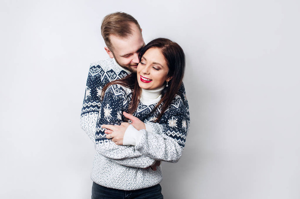 Loving winter couple on white background - Фото, зображення