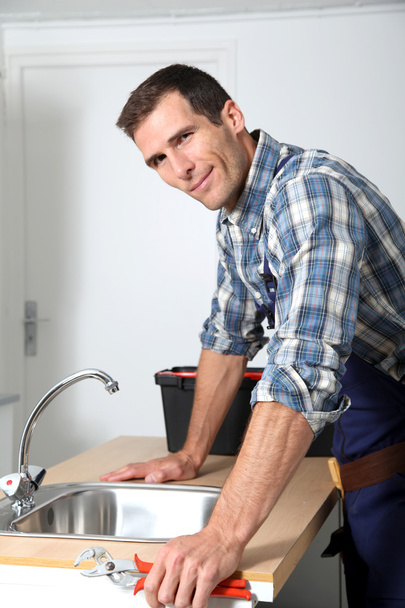 Plumber fixing domestic sink - Fotografie, Obrázek