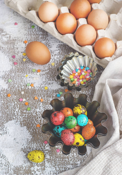 Colored easter eggs and baking molds on a light canvas background,place for text - Foto, immagini