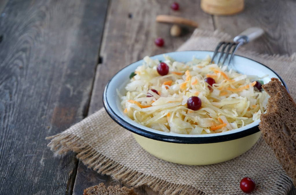 Sauerkraut with cranberries in a bowl - Fotoğraf, Görsel