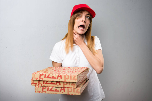 Pizza delivery woman drowning herself on textured background - Fotografie, Obrázek