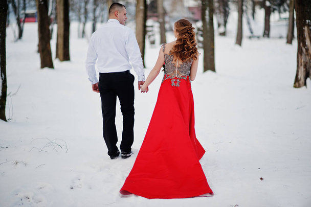 Amazing couple in winter fairytale forest in love. Girl in red b - Foto, immagini