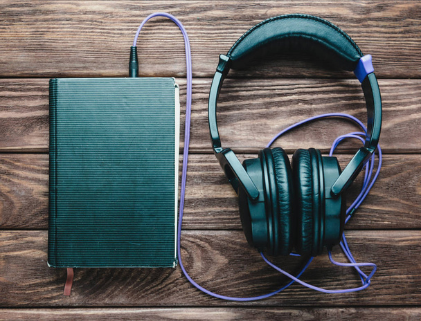 Headphones with a book.  - Φωτογραφία, εικόνα