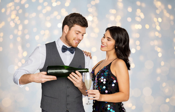 happy couple with champagne and glass at party - Фото, изображение