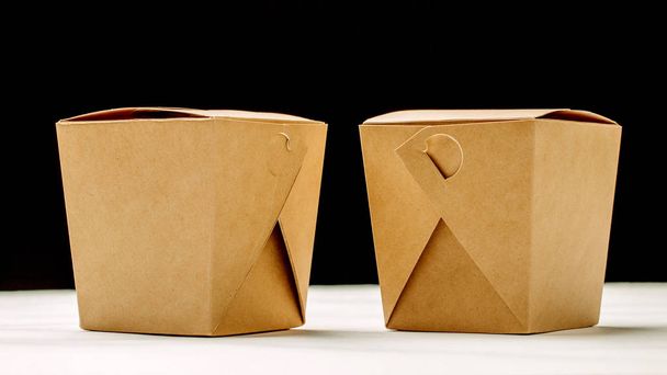 Two closed WOK paper box. Asian fast food concept. - Zdjęcie, obraz