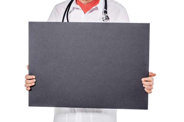 close up of doctor holding blank black banner - Foto, imagen