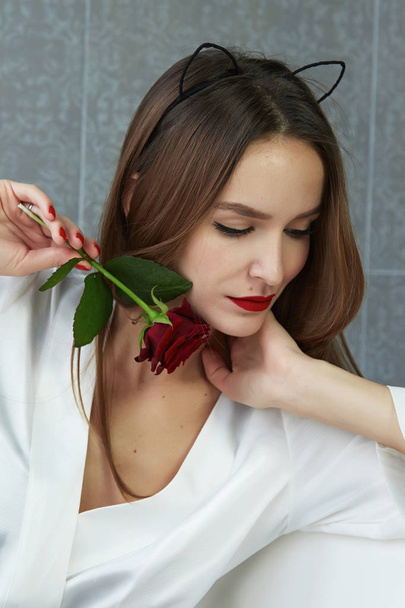 Sexy woman in bathroom in silk robe rose Valentine's day - Photo, Image