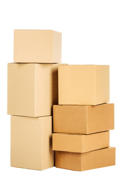 Pile of cardboard boxes on a white background - Фото, изображение