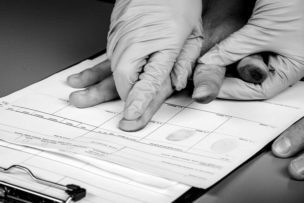 police takes fingerprints of a criminal - Photo, image