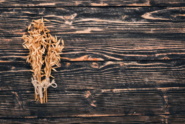 Oats on a wooden background. Top view. Copy space. - Foto, Imagen