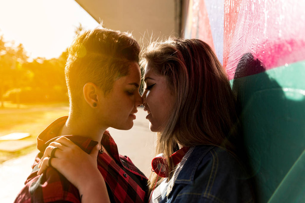 Lesbian Couple Kissing on Sunset Time - Фото, зображення