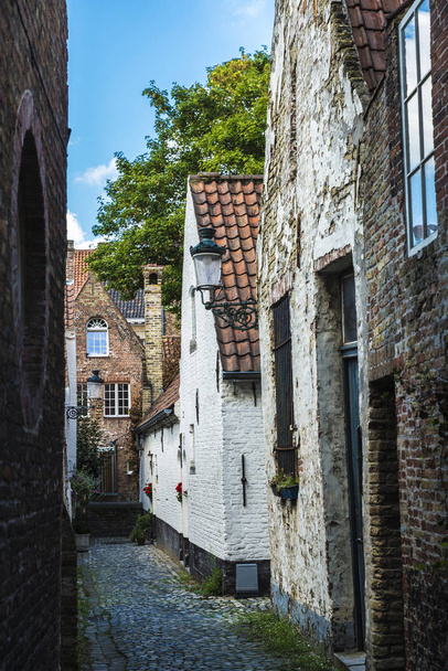 Narrow street with old houses in Bruges, Belgium - Photo, image