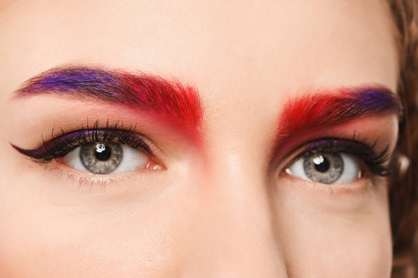 Young woman with dyed eyebrows, closeup - Foto, afbeelding