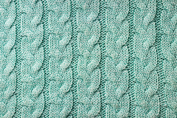 Turquoise knitted background. Knitted texture. A sample of knitt - Fotó, kép