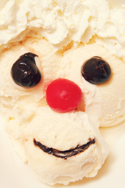 An ice cream sundae arranged to make a face. - Photo, Image