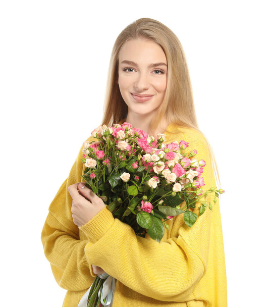 Beautiful young woman with bouquet of roses on white background - Photo, Image