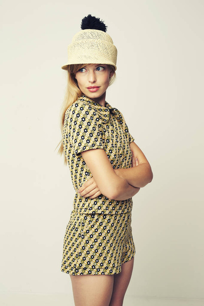Young woman wearing hat t-shirt and shorts, studio shot - Fotoğraf, Görsel