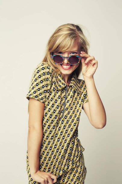 Portrait of cool girl in sunglasses, studio - Fotó, kép