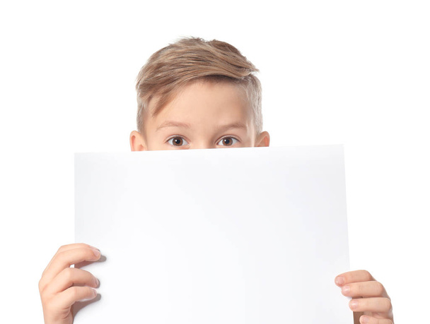 Cute boy with blank sheet of paper for advertising on white background - Фото, зображення