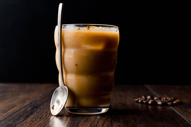Instant Cold Coffee with Milk, Ice, Spoon and Coffee Beans. - Fotó, kép
