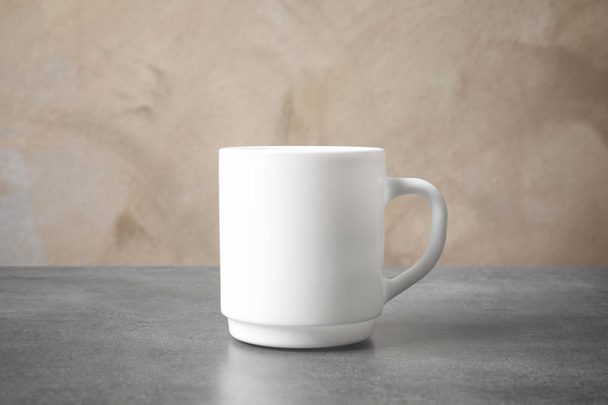 Ceramic cup on table. Mockup for design - 写真・画像