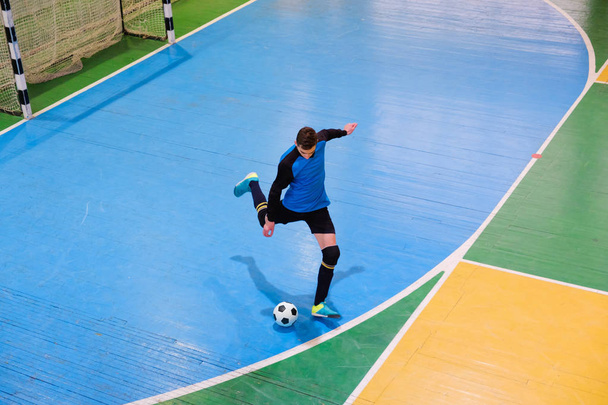 Football goalkeeper on goal, field, Futsal ball field in the gym indoor, Soccer sport field - Foto, afbeelding