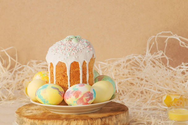 Pastel and colorful easter eggs and Easter cake. Easter eggs painted in pastel colors - Photo, image