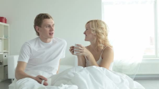 Couple drinking tea at bed - Footage, Video