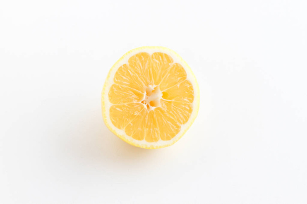 Lemon cut in half. Half lemon on white background. - Photo, image
