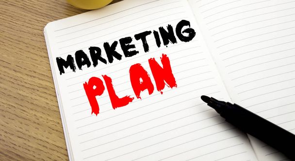 Handwritten text caption showing Marketing Plan. Business concept writing for Planning Successful Strategy written on notebook with copy space on book background with marker pen - Foto, afbeelding
