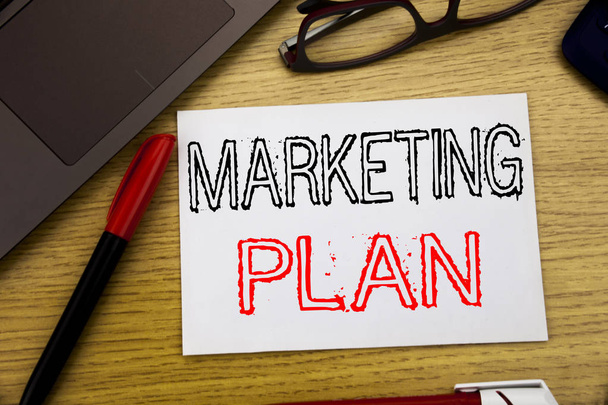 Handwriting Announcement text showing Marketing Plan. Business concept for Planning Successful Strategy written on paper, wooden background in office with copy space, marker pen and glasses - Photo, image
