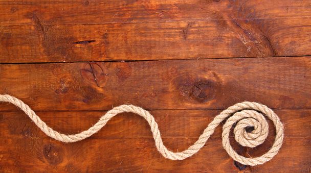 Keret tagjai: kötél, fából készült háttér - Fotó, kép