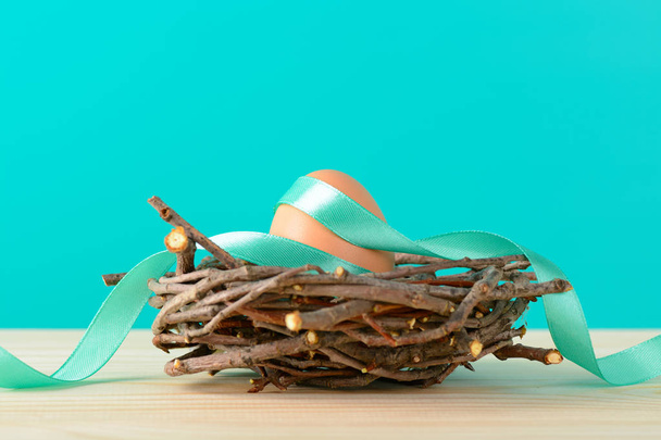 Egg with ribbon in nest - Photo, Image
