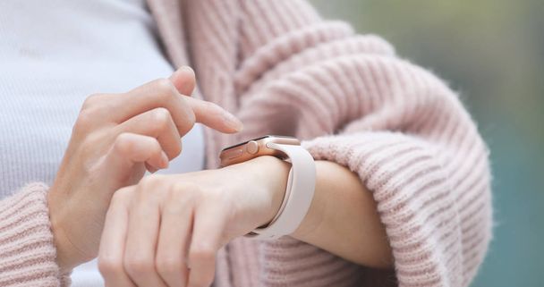 Woman using smart watch  - Fotografie, Obrázek