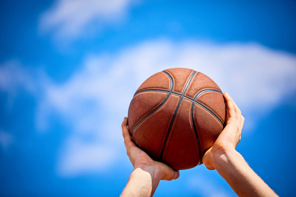 man playing basketball ball, close-up  - 写真・画像